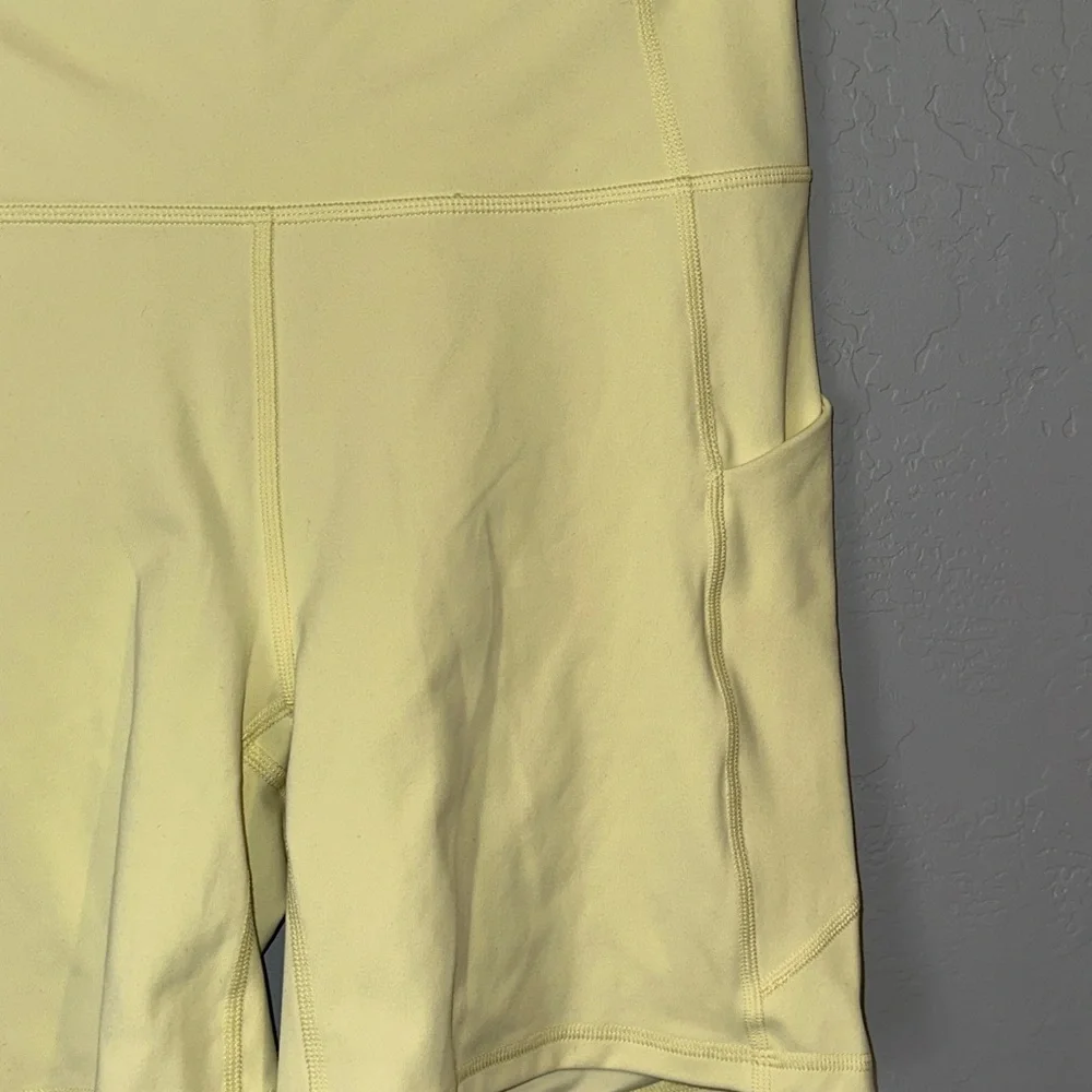 Fabletics Pale Yellow Bike Shorts with Side Pockets - Picture 3 of 6
